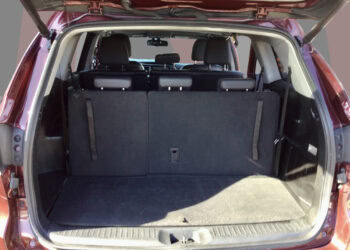 An image showcasing the spacious cargo area of a 2015 Toyota Highlander XLE hybrid SUV.
