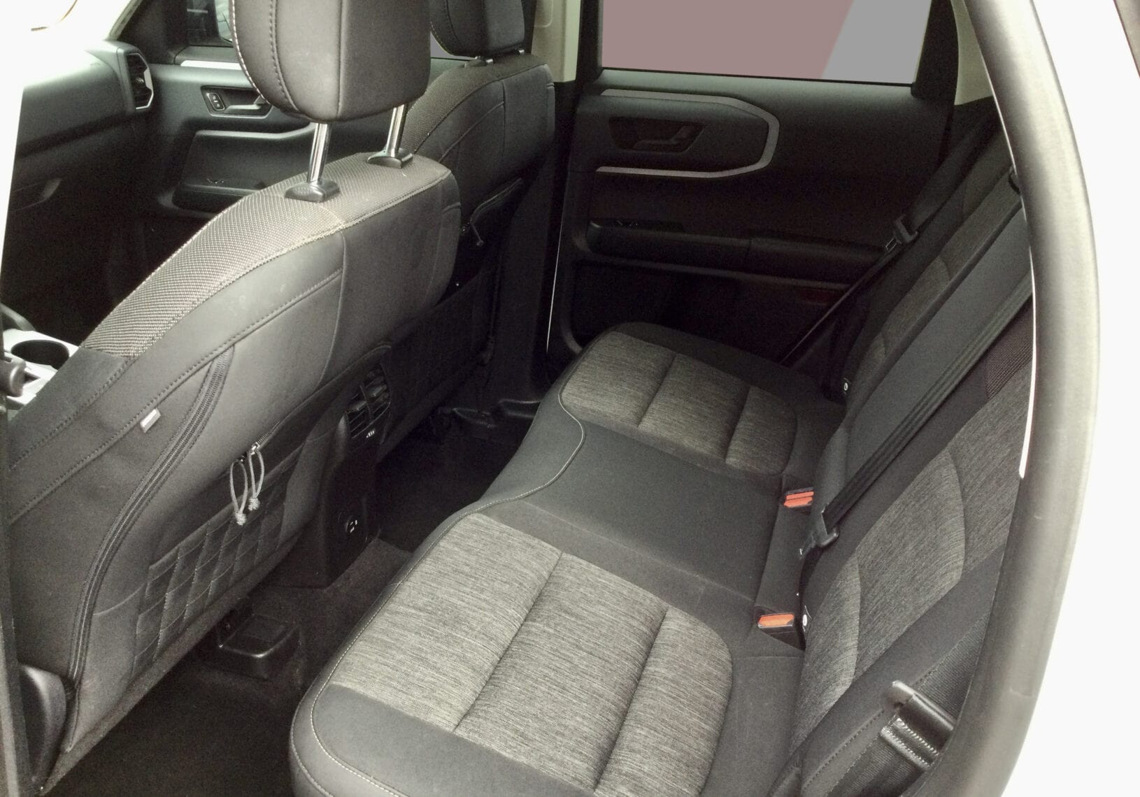 Spacious rear seats of the 2022 Ford Bronco Sport Big Bend with heated seats and large infotainment.