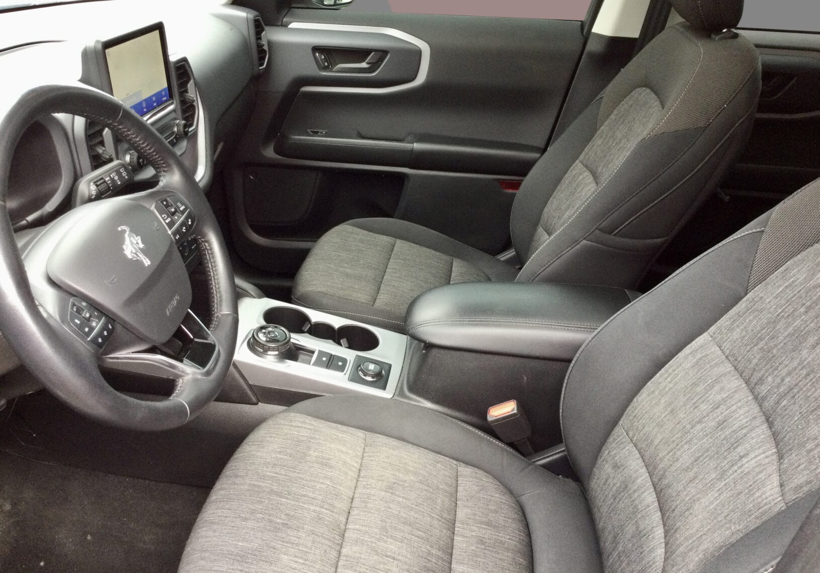 Interior view of the 2022 Ford Bronco Sport with heated seats and large infotainment screen.
