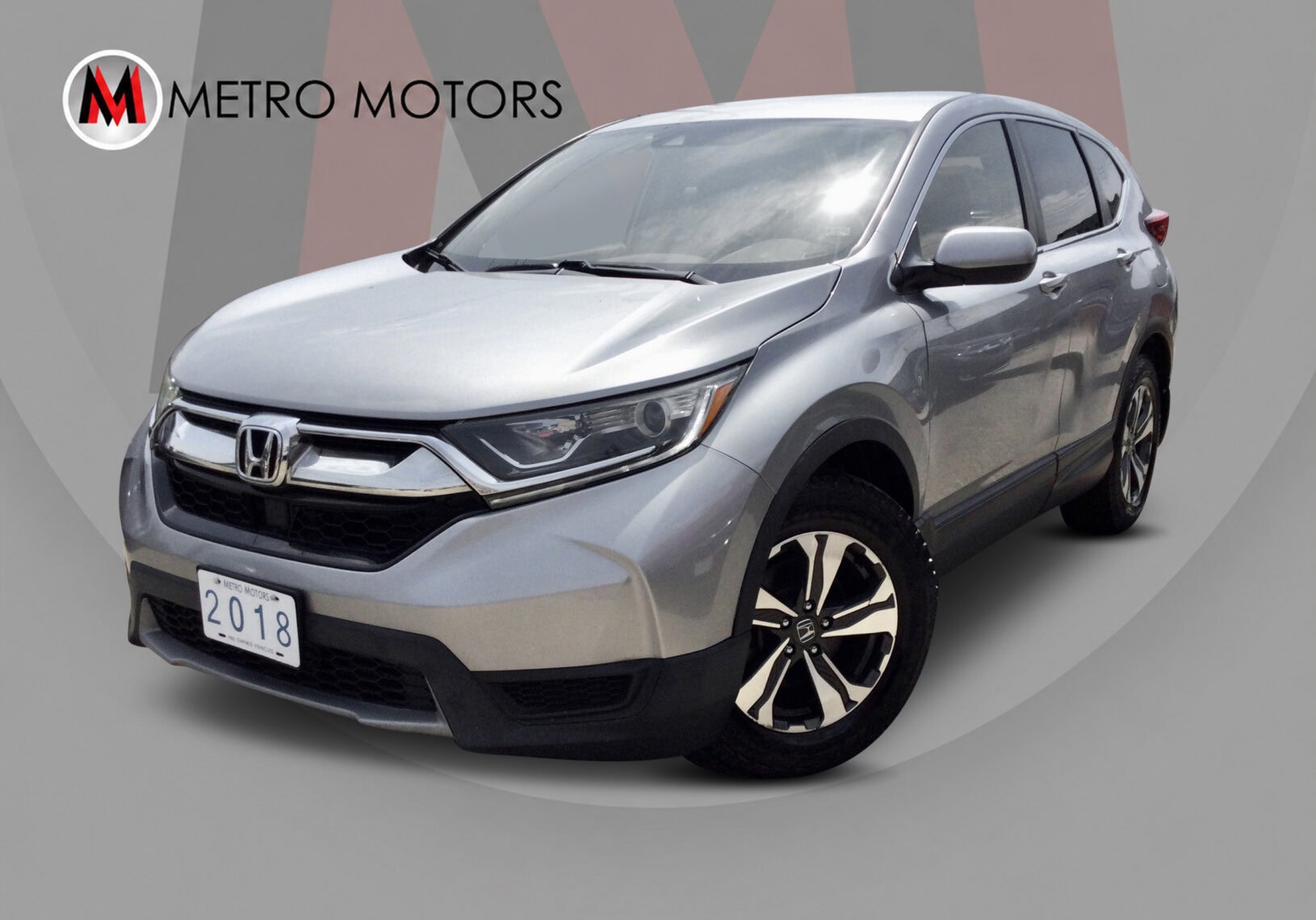 2018 Honda CR-V LX with alloy wheels and rear camera.
