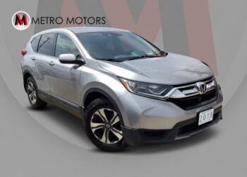 Silver 2018 Honda CR-V LX with alloy wheels and rear camera.