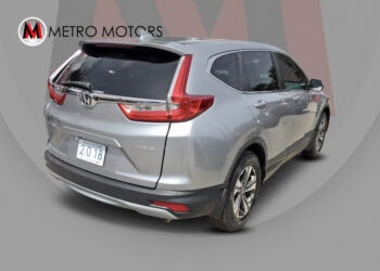 Silver 2018 Honda CR-V LX with alloy wheels and rear camera.